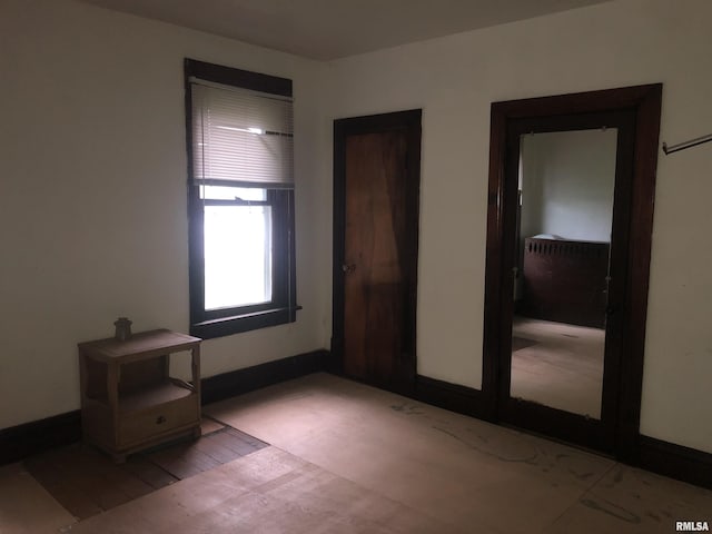 342 W Reynolds St, Springfield, IL 62702 - unfurnished bedroom featuring baseboards and light wood-style floors