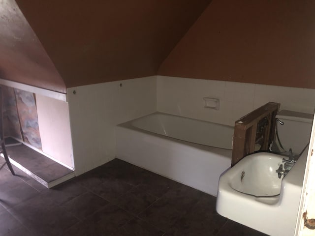 342 W Reynolds St, Springfield, IL 62702 - bathroom with lofted ceiling, a bath, and tile patterned floors