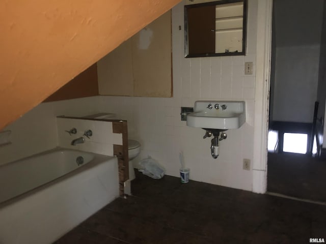 342 W Reynolds St, Springfield, IL 62702 - bathroom with tile patterned floors, a garden tub, and tile walls