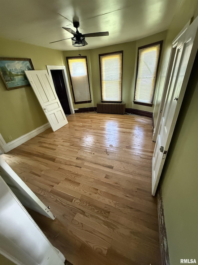 342 W Reynolds St, Springfield, IL 62702 - unfurnished bedroom with wood finished floors and a ceiling fan