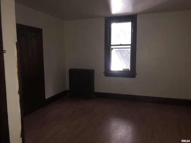 342 W Reynolds St, Springfield, IL 62702 - unfurnished room featuring radiator and wood finished floors
