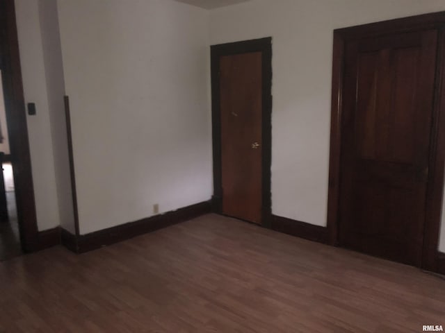 342 W Reynolds St, Springfield, IL 62702 - unfurnished bedroom with wood finished floors and baseboards