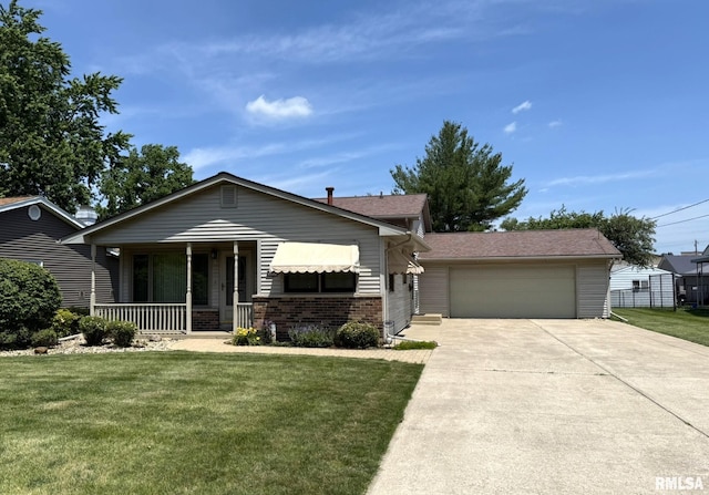 597 Walnut St, Knoxville, IL 61448 - view of front of home featuring covered porch, a front yard, brick siding, and driveway
