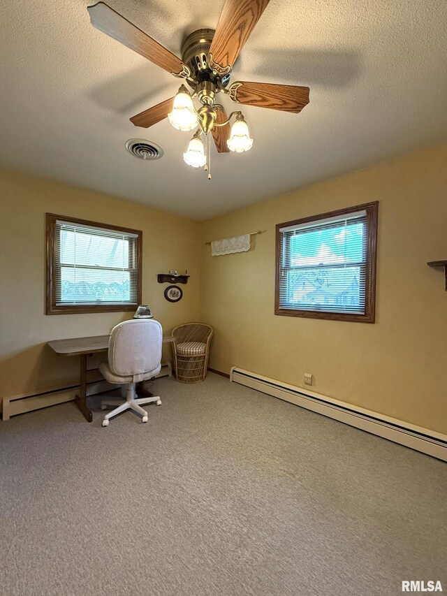 597 Walnut St, Knoxville, IL 61448 - unfurnished office featuring a baseboard radiator, carpet floors, and a ceiling fan