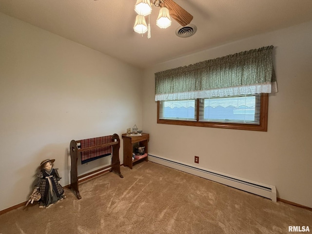 597 Walnut St, Knoxville, IL 61448 - unfurnished room featuring a baseboard radiator, carpet floors, and ceiling fan