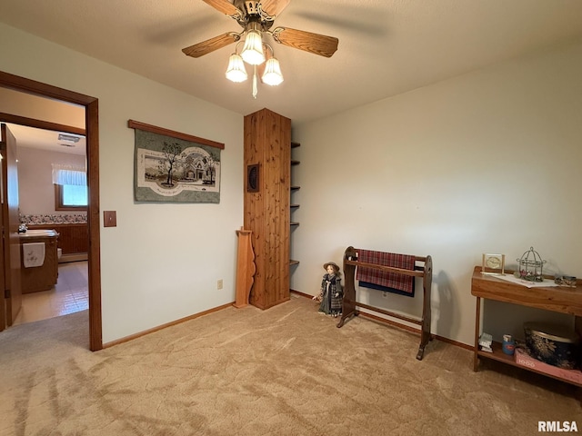 597 Walnut St, Knoxville, IL 61448 - sitting room with light colored carpet, ceiling fan, and baseboard heating