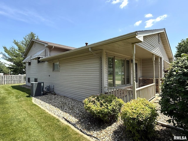597 Walnut St, Knoxville, IL 61448 - view of property exterior with a central AC unit and covered porch