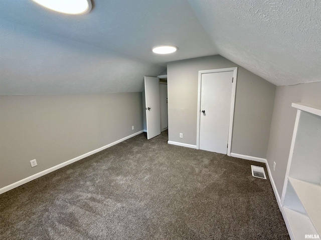 2015 N 19th St, Springfield, IL 62702 - additional living space featuring lofted ceiling, carpet, and a textured ceiling