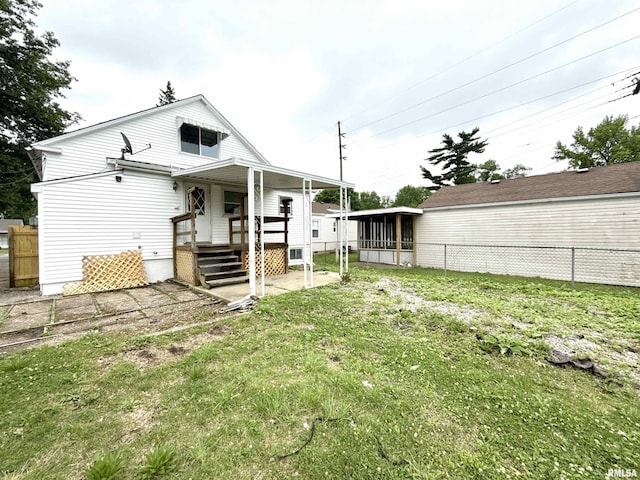 2015 N 19th St, Springfield, IL 62702 - back of house featuring a sunroom