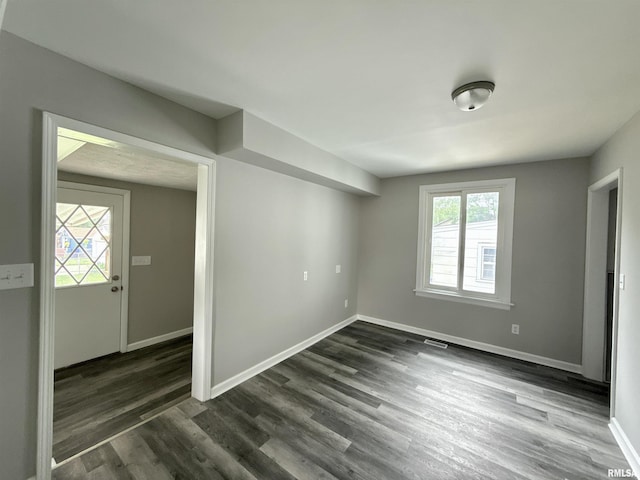 2015 N 19th St, Springfield, IL 62702 - empty room featuring dark wood-style flooring and baseboards