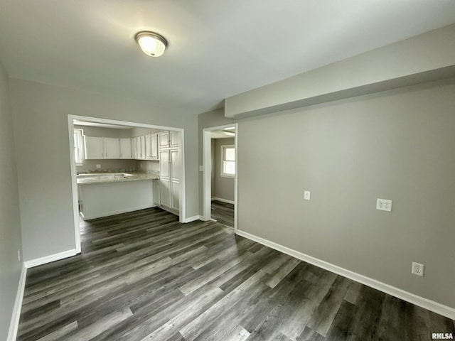 2015 N 19th St, Springfield, IL 62702 - unfurnished living room with dark wood-style floors
