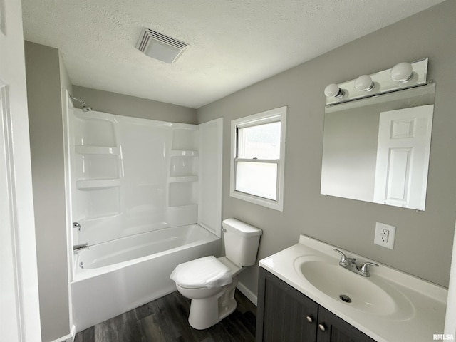 2015 N 19th St, Springfield, IL 62702 - full bathroom featuring wood finished floors, vanity, a textured ceiling, and shower / washtub combination