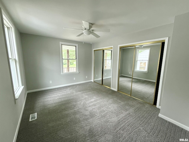 2015 N 19th St, Springfield, IL 62702 - unfurnished bedroom with two closets, carpet, and ceiling fan