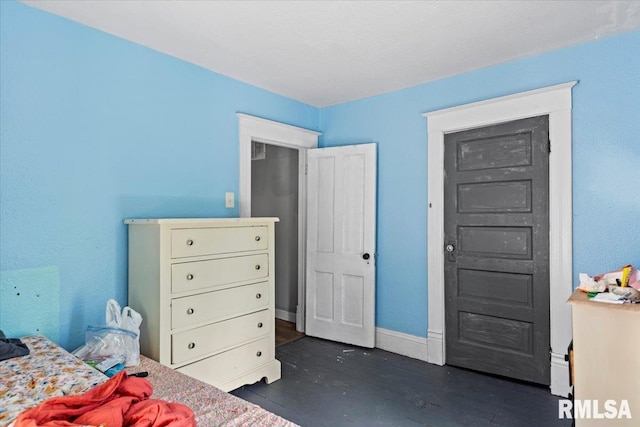 826 S Douglas Ave, Springfield, IL 62704 - bedroom with dark wood-type flooring and baseboards