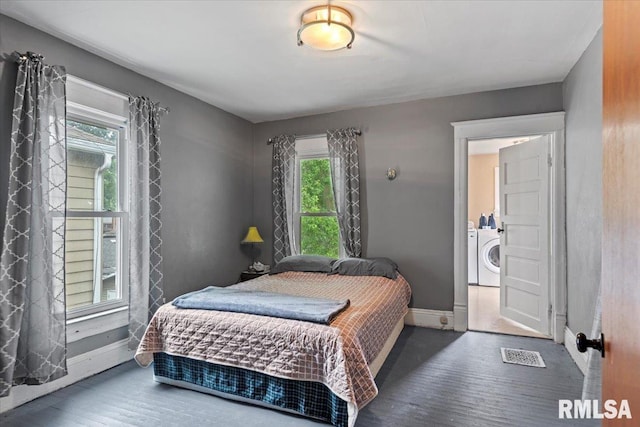826 S Douglas Ave, Springfield, IL 62704 - bedroom featuring wood finished floors and washer / dryer