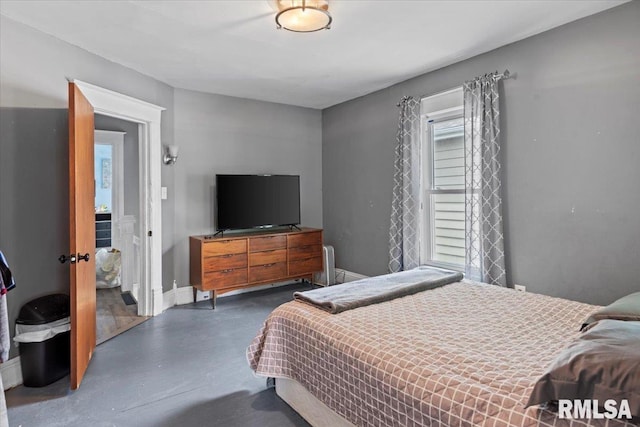 826 S Douglas Ave, Springfield, IL 62704 - bedroom featuring concrete flooring and baseboards