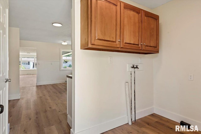 707 N Adams St, Lincoln, IL 62656 - laundry room with cabinet space, wood finished floors, and hookup for a washing machine