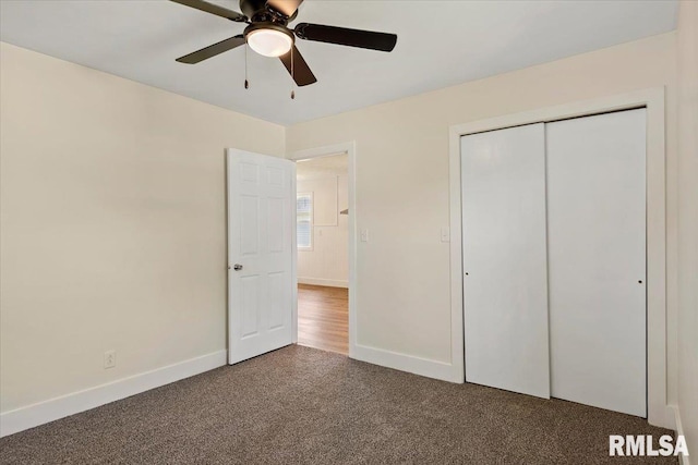 707 N Adams St, Lincoln, IL 62656 - unfurnished bedroom featuring carpet flooring, a closet, and ceiling fan