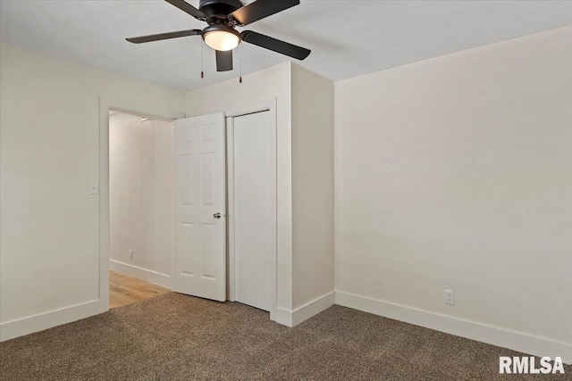 707 N Adams St, Lincoln, IL 62656 - unfurnished bedroom featuring light colored carpet, a ceiling fan, and a closet