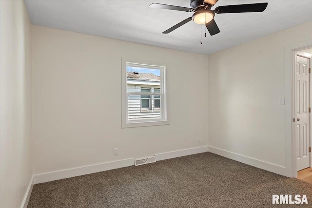 707 N Adams St, Lincoln, IL 62656 - unfurnished room featuring carpet floors and ceiling fan