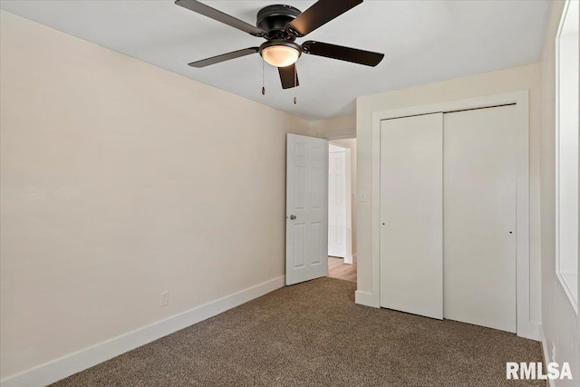 707 N Adams St, Lincoln, IL 62656 - unfurnished bedroom with carpet, a closet, and ceiling fan