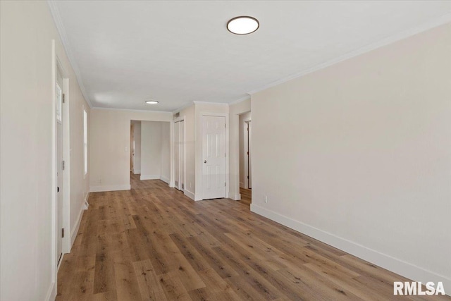 707 N Adams St, Lincoln, IL 62656 - unfurnished room with crown molding, wood finished floors, and recessed lighting