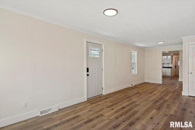 707 N Adams St, Lincoln, IL 62656 - foyer with ornamental molding and wood finished floors