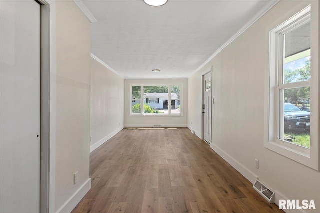 707 N Adams St, Lincoln, IL 62656 - hall with wood finished floors and crown molding