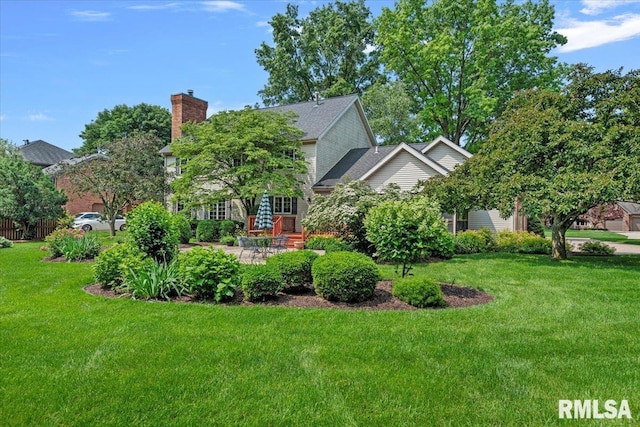 828 Coventry Pt, Springfield, IL 62702 - view of property exterior with a lawn, a chimney, and a patio