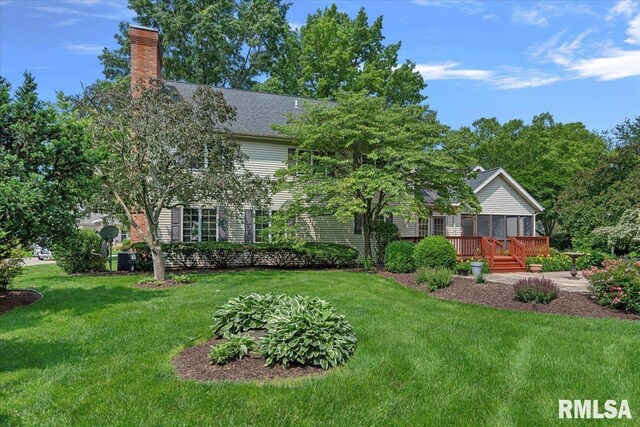 828 Coventry Pt, Springfield, IL 62702 - view of grassy yard with a sunroom and a wooden deck