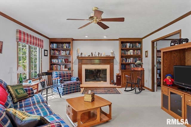 828 Coventry Pt, Springfield, IL 62702 - living room featuring crown molding, a ceiling fan, carpet, a premium fireplace, and built in features