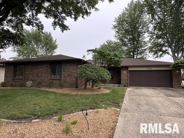 2524 Greenbriar Rd, Springfield, IL 62704 - view of front of property featuring an attached garage, a front yard, driveway, and brick siding