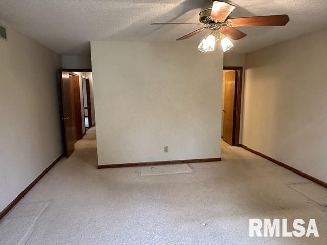 2524 Greenbriar Rd, Springfield, IL 62704 - unfurnished room with a ceiling fan, light carpet, and a textured ceiling