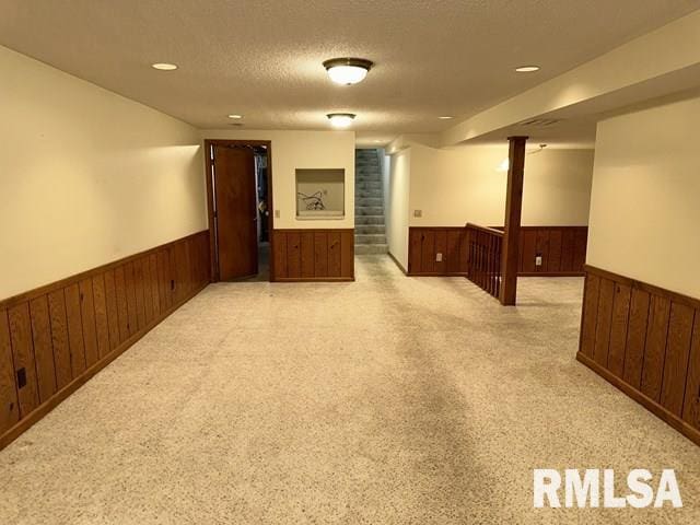 2524 Greenbriar Rd, Springfield, IL 62704 - spare room featuring a wainscoted wall, wood walls, a textured ceiling, and recessed lighting