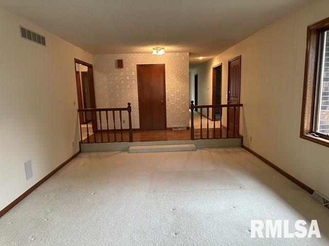 2524 Greenbriar Rd, Springfield, IL 62704 - carpeted empty room with baseboards