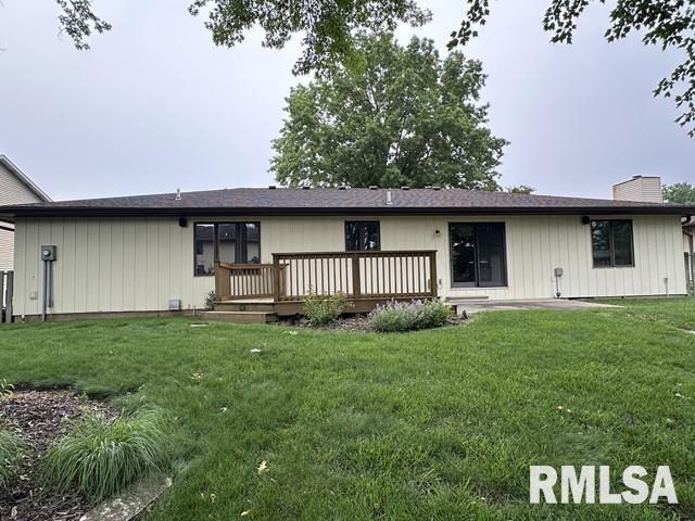2524 Greenbriar Rd, Springfield, IL 62704 - back of property featuring a wooden deck, a lawn, and a chimney