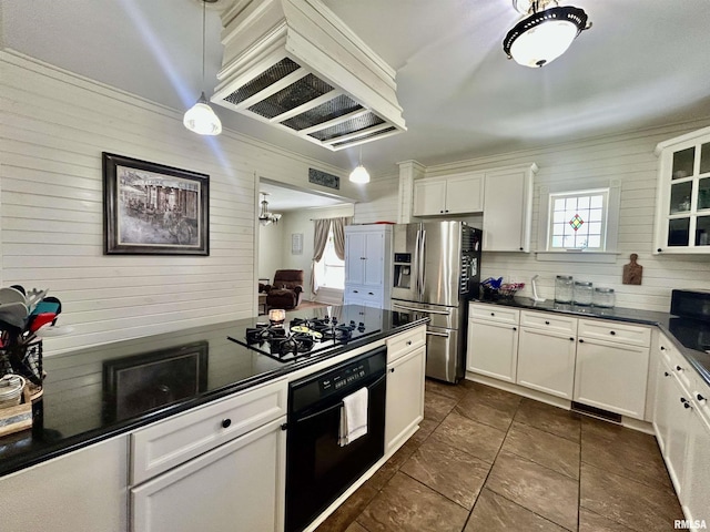 120 S Walnut St, Assumption, IL 62510 - kitchen with black appliances, dark countertops, white cabinetry, custom exhaust hood, and wooden walls