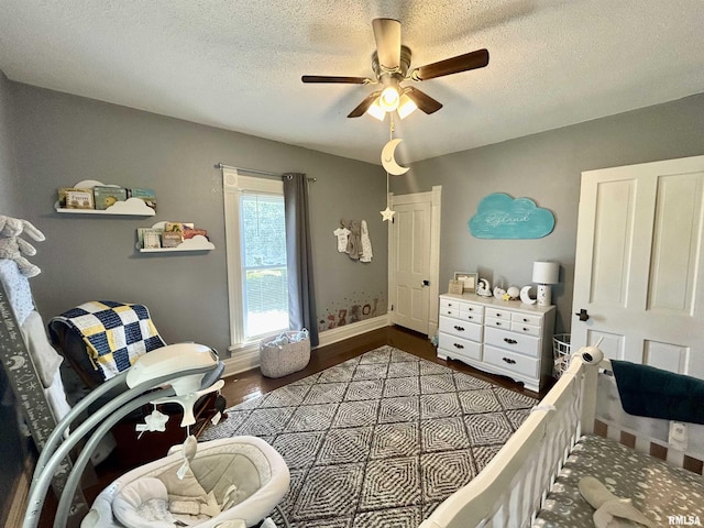 120 S Walnut St, Assumption, IL 62510 - bedroom featuring wood finished floors, a textured ceiling, and ceiling fan