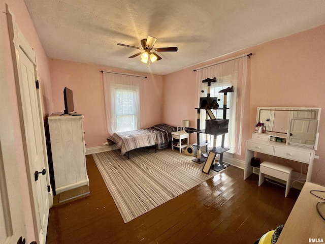 120 S Walnut St, Assumption, IL 62510 - bedroom featuring dark wood-style flooring and a ceiling fan