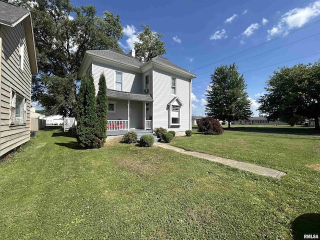 120 S Walnut St, Assumption, IL 62510 - view of front of property featuring a porch and a front yard