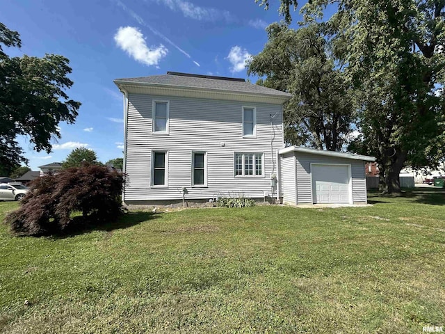 120 S Walnut St, Assumption, IL 62510 - back of property featuring a yard and a garage