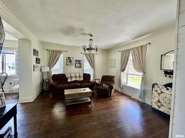 120 S Walnut St, Assumption, IL 62510 - living room featuring a chandelier, hardwood / wood-style flooring, plenty of natural light, and crown molding