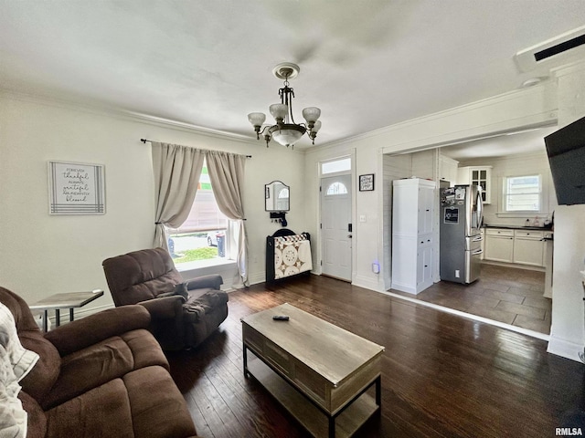 120 S Walnut St, Assumption, IL 62510 - living area featuring ornamental molding, a chandelier, and dark wood-type flooring