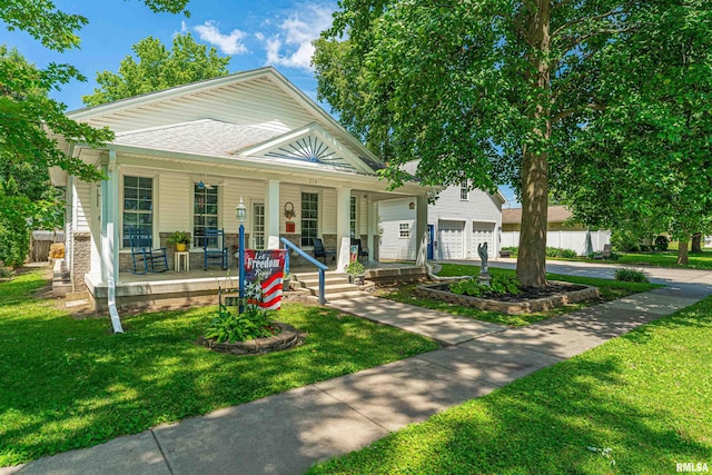 216 3rd St, Lincoln, IL 62656 - view of front of property with covered porch, a garage, and driveway