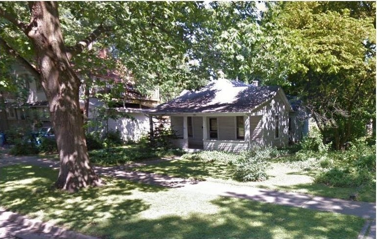 410 W Healey St, Champaign, IL 61820 - view of front of home featuring covered porch, a front yard, and a chimney