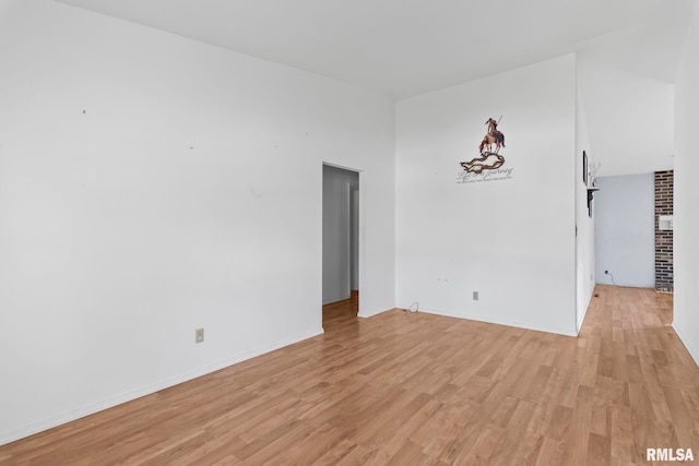 2924 Flowerbrook Ct, Springfield, IL 62702 - spare room with light wood-style flooring and vaulted ceiling