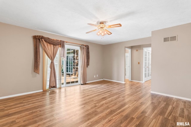 2924 Flowerbrook Ct, Springfield, IL 62702 - unfurnished room featuring light wood-style flooring, ceiling fan, and a textured ceiling