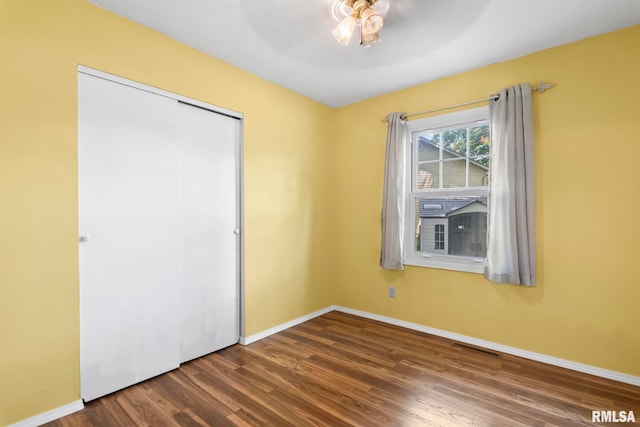 2924 Flowerbrook Ct, Springfield, IL 62702 - unfurnished bedroom featuring wood finished floors, a closet, and a ceiling fan