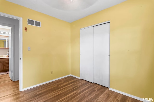 2924 Flowerbrook Ct, Springfield, IL 62702 - unfurnished bedroom featuring wood finished floors and a closet
