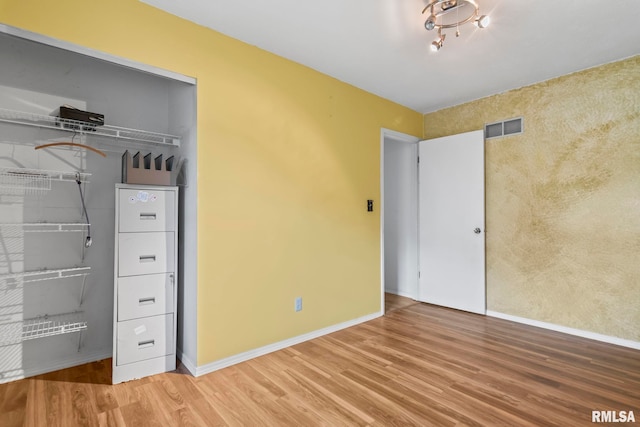 2924 Flowerbrook Ct, Springfield, IL 62702 - unfurnished bedroom featuring wood finished floors and a closet